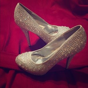 Silver diamond high heeled platforms.